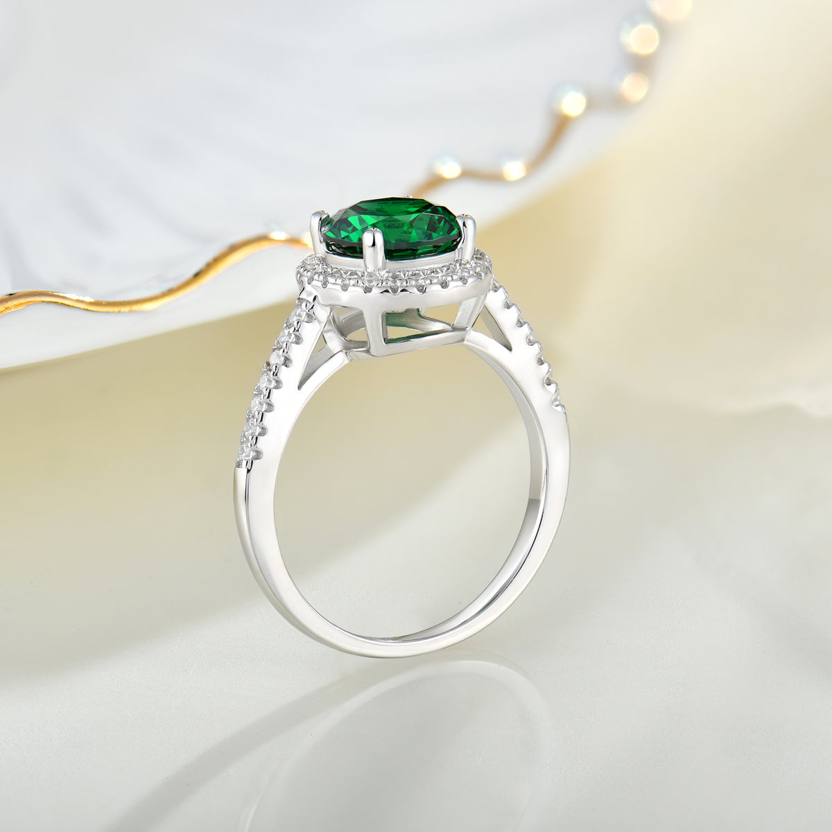 Runder Halo-Smaragdring