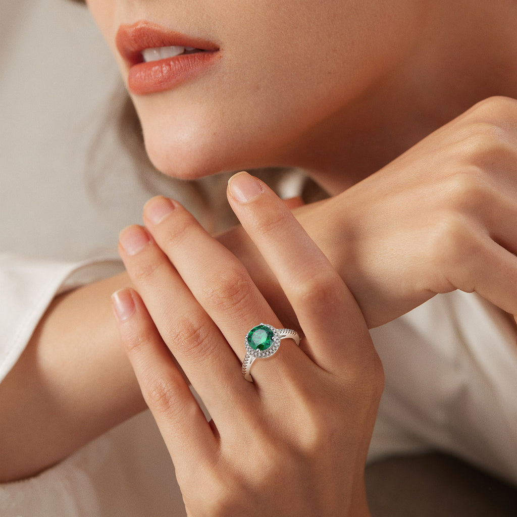 Runder Halo-Smaragdring