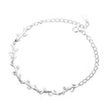 A sterling silver bracelet with a leaf pattern design.