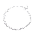 A sterling silver bracelet with a leaf pattern design.