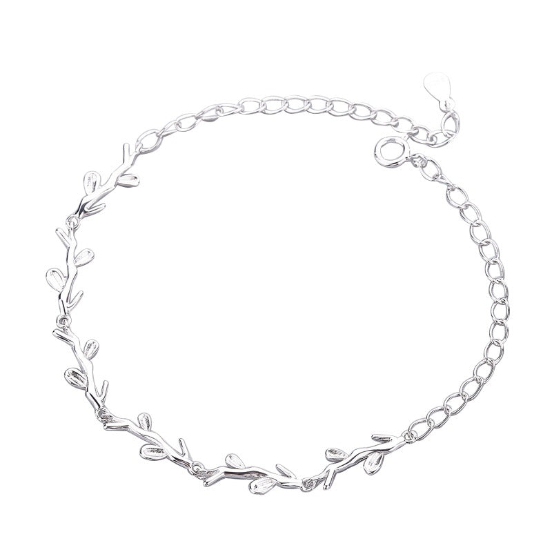 A sterling silver bracelet with a leaf pattern design.